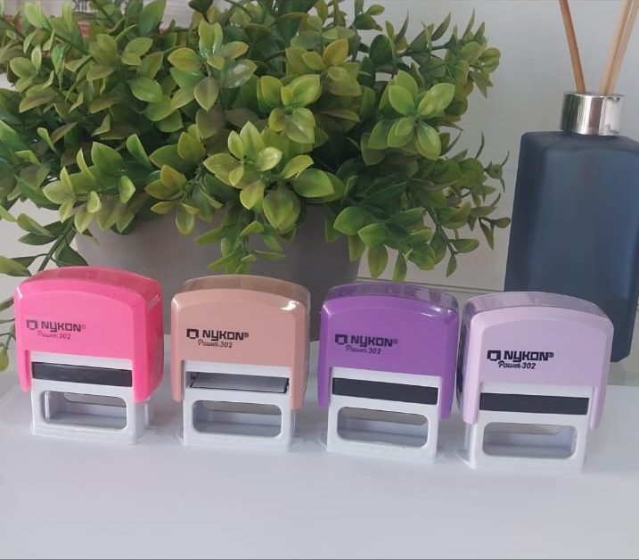 Quatro carimbos Nykon Power 302 em rosa, pêssego, roxo e lilás
